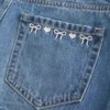Low-Rise Embroidered Bow Denim Mini Skort Low-Rise Embroidered Bow Denim Mini Skort