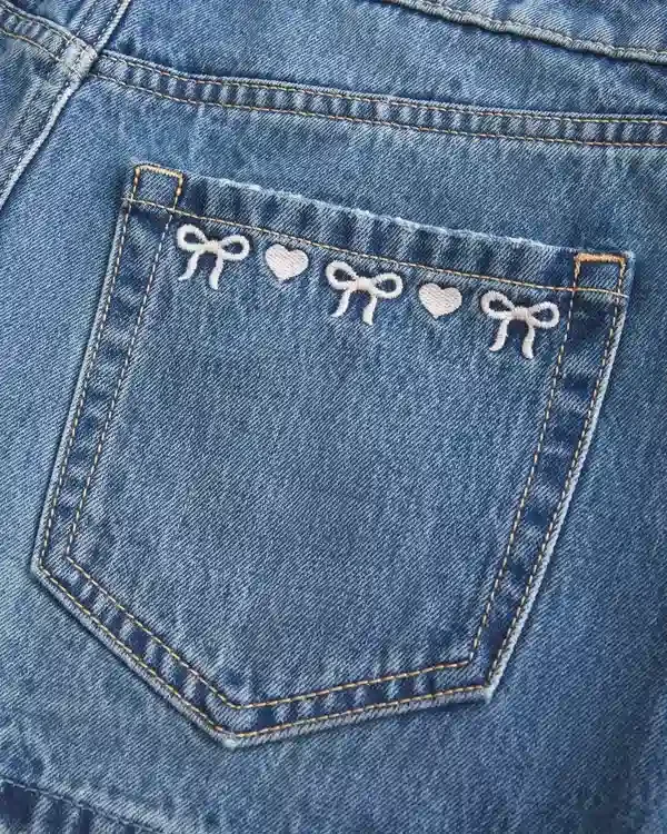 Low-Rise Embroidered Bow Denim Mini Skort Low-Rise Embroidered Bow Denim Mini Skort