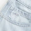 Low-Rise Light Wash Bow Graphic Baggy Jort